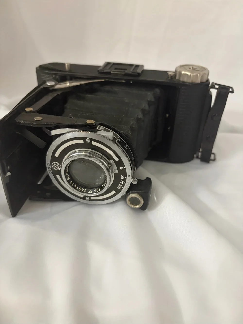 Black Folding Bellows Film Camera with Silver Lens Assembly
